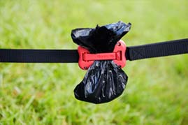 dog poop bag holder in use